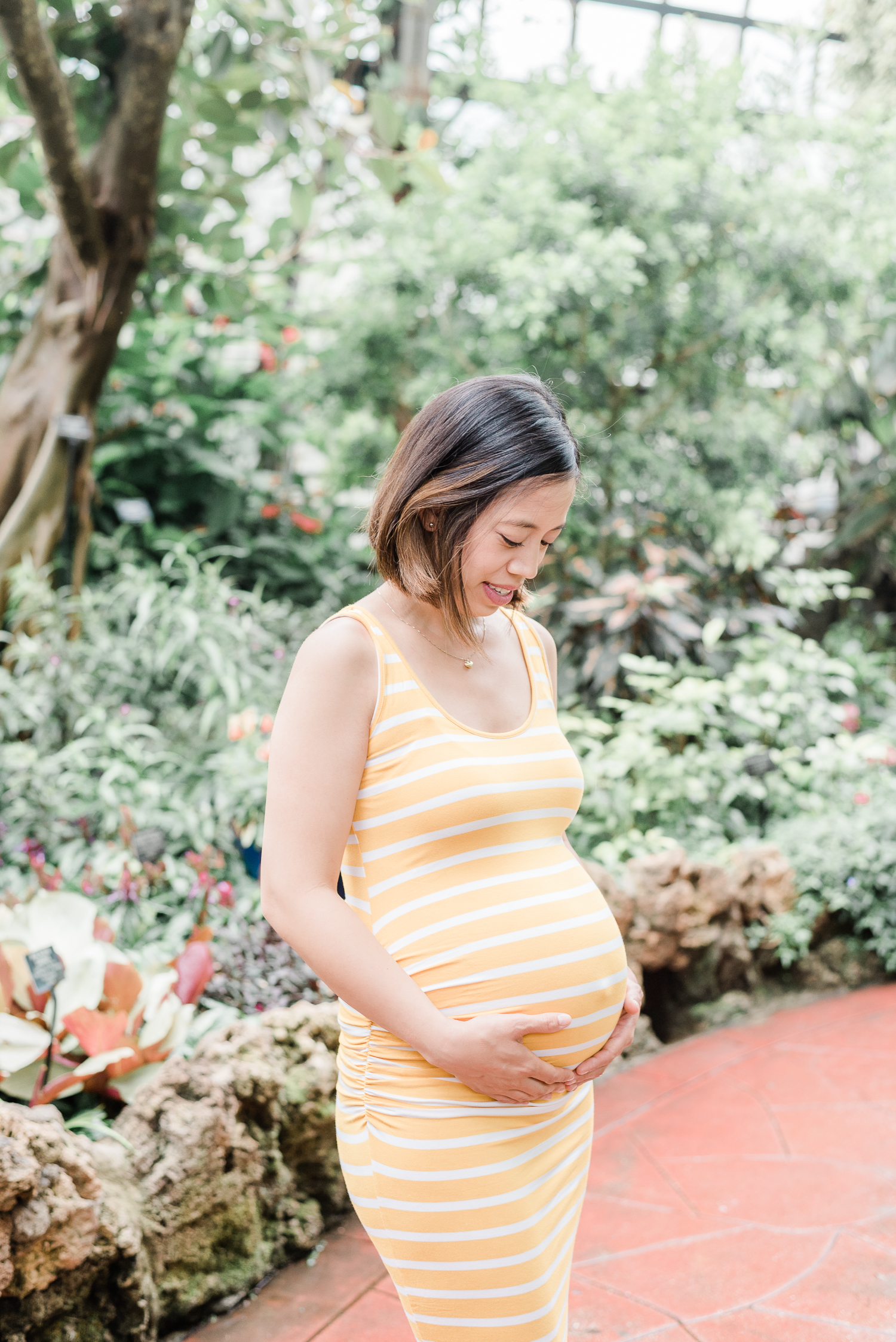 Pregnant lady in yellow striped dress at the Lincoln Park Conservatory