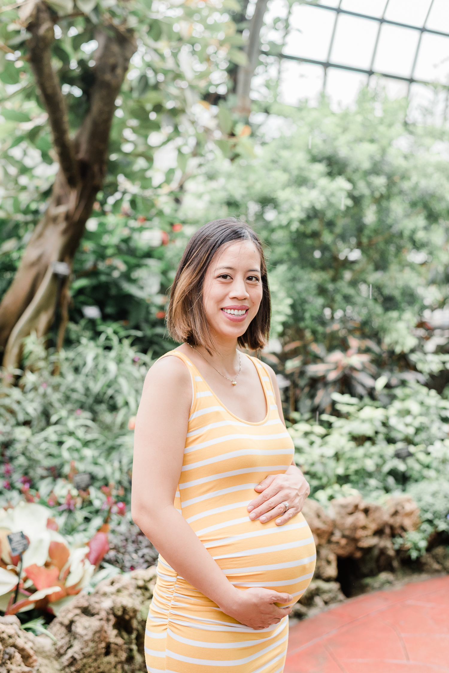 Pregnant lady in yellow striped dress at the Lincoln Park Conservatory