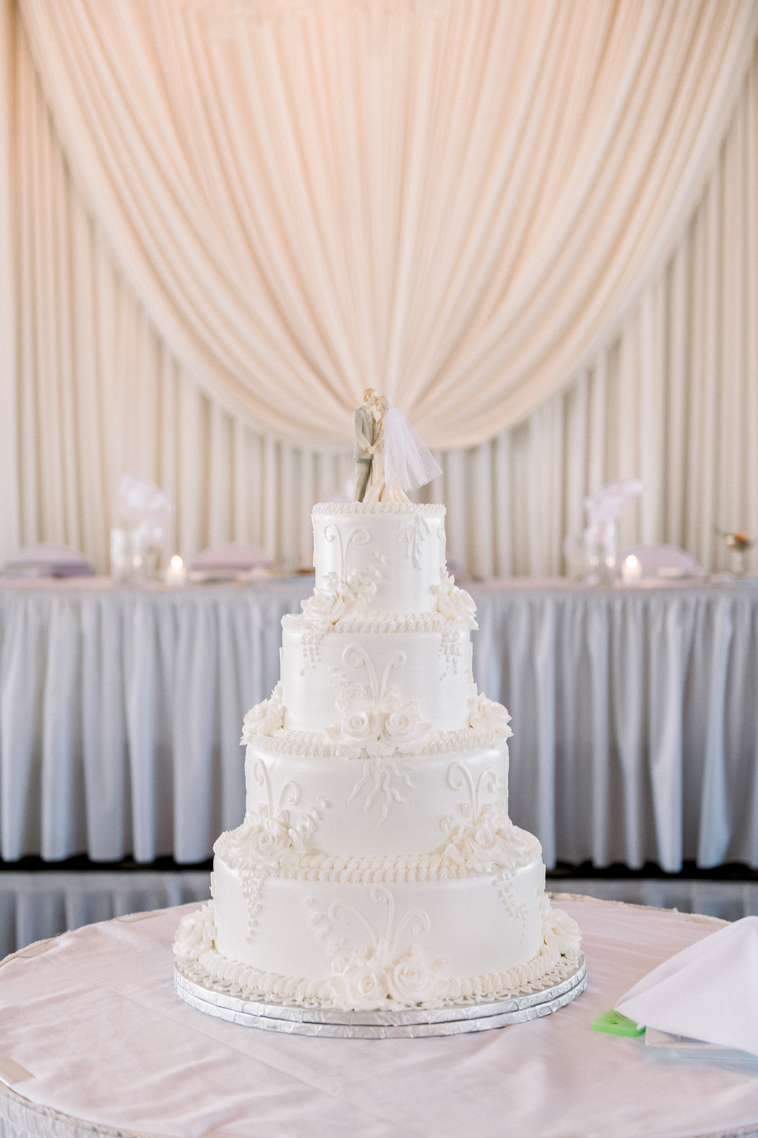 White 4-tiered buttercream wedding cake