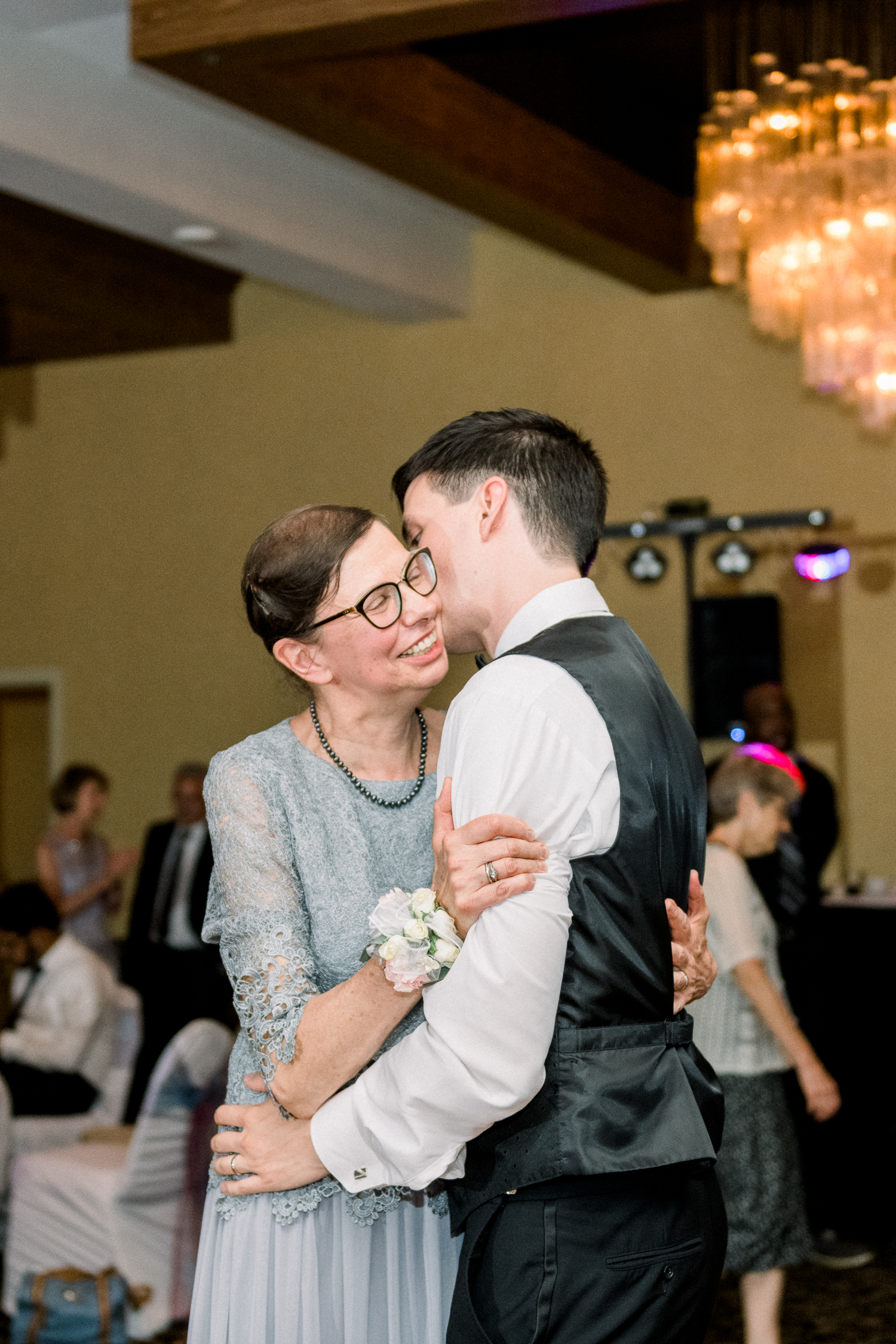 Groom kisses mother during first dance