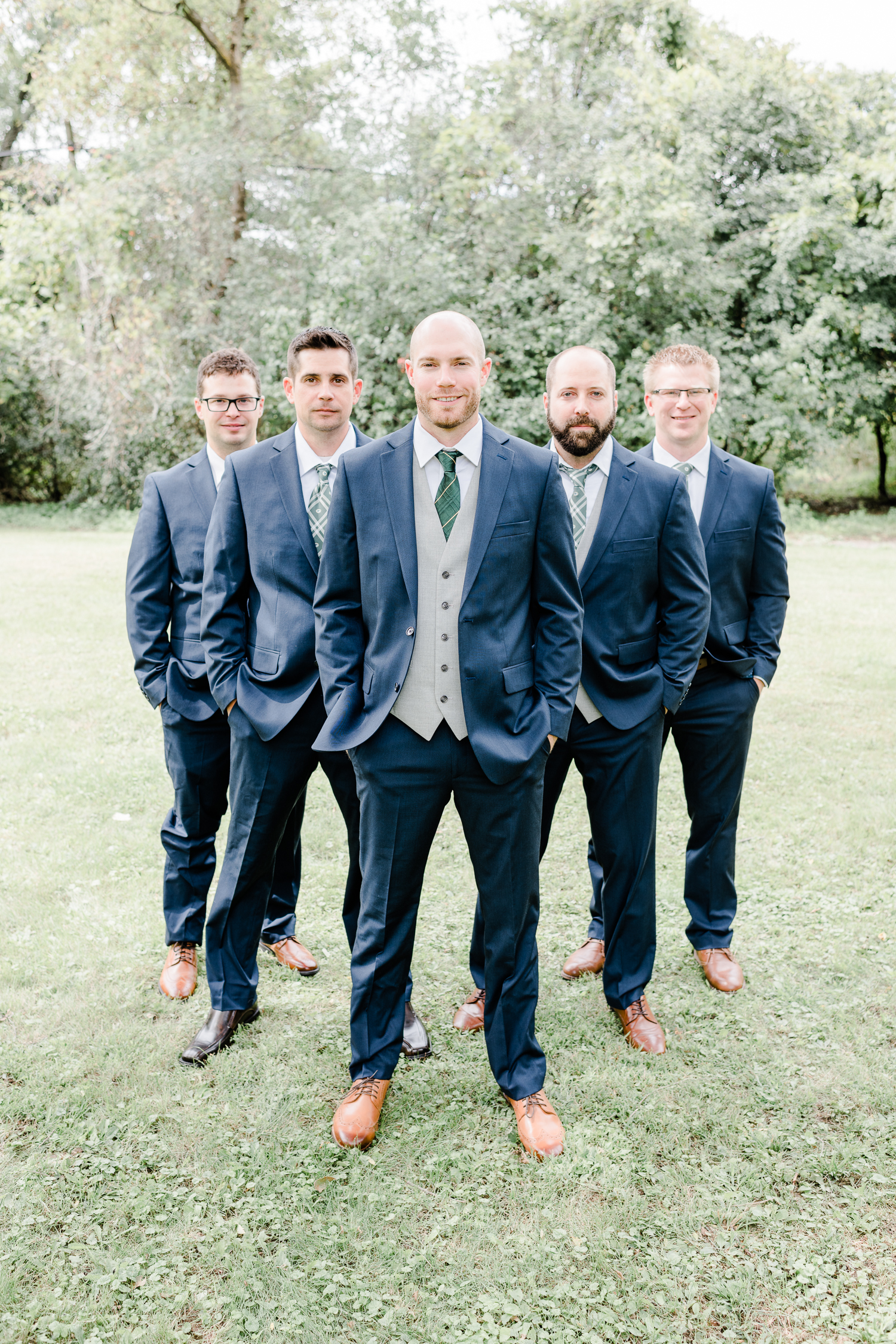 Groom with groomsmen in blue suits