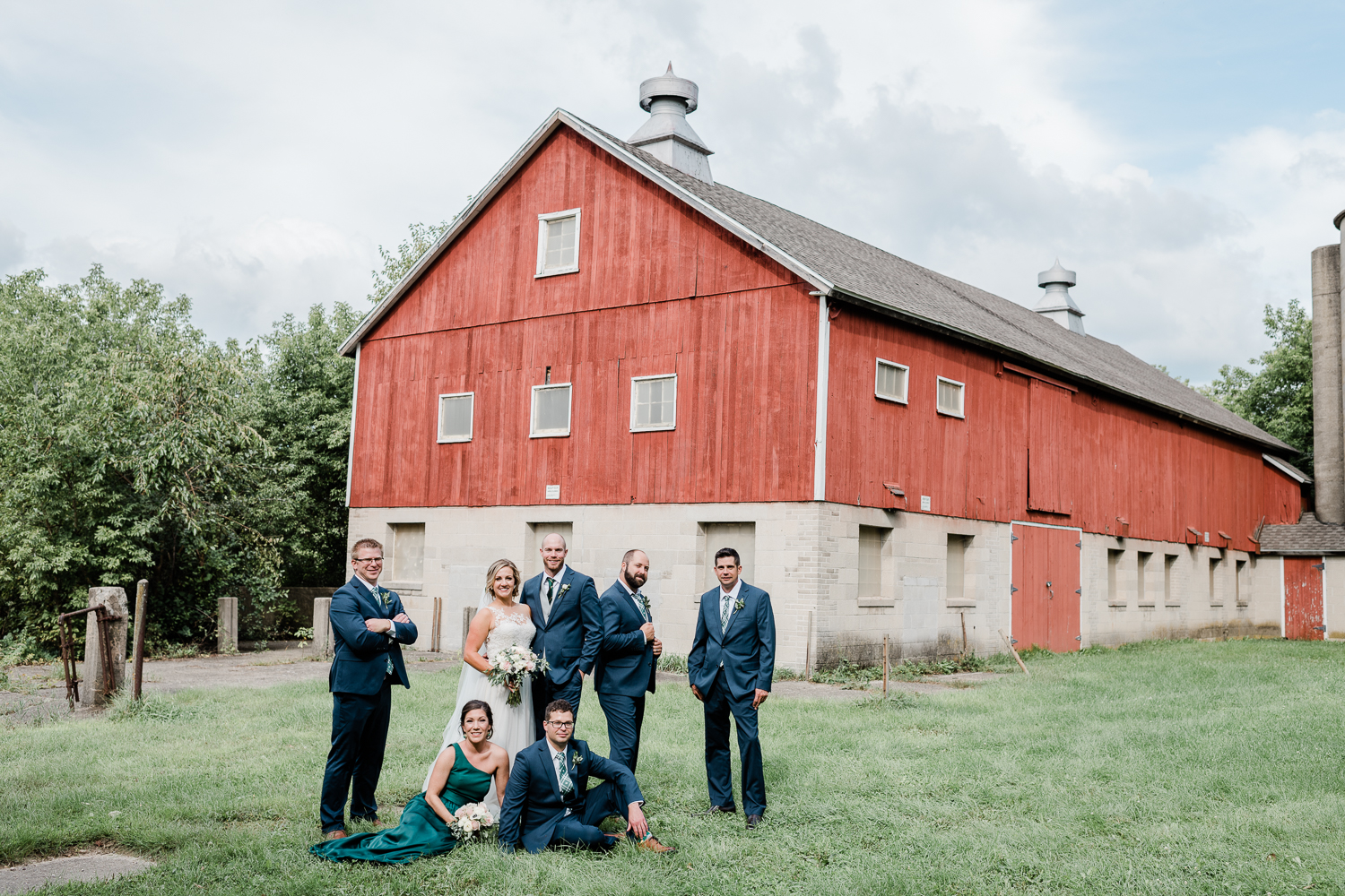 Bridal party outside the red barn