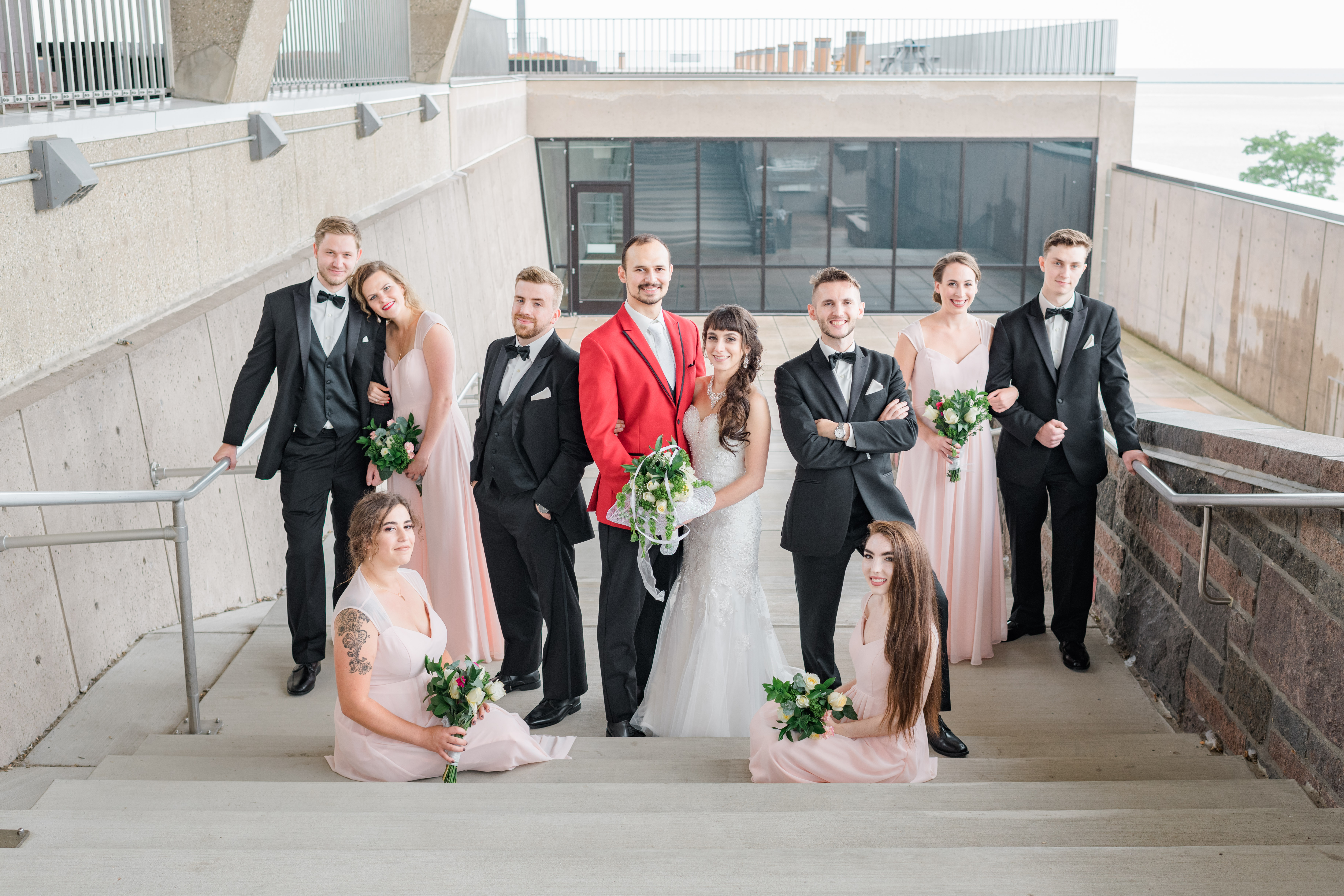 Bridal party posing on stairs of War Memorial Museum