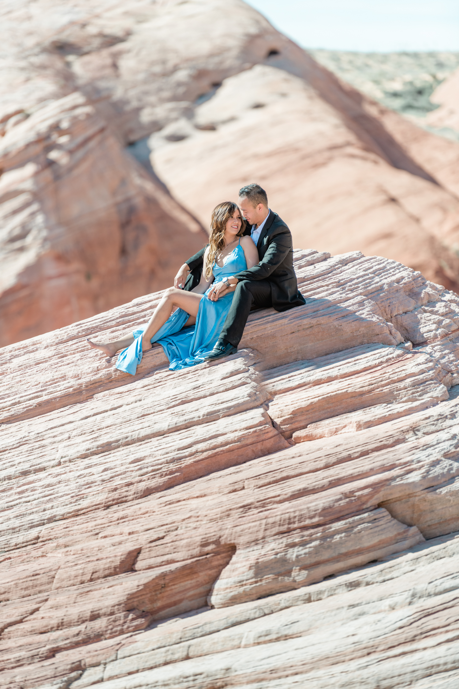 Engaged couple at the top of a canyon at Valley of the Fire in Las Vegas