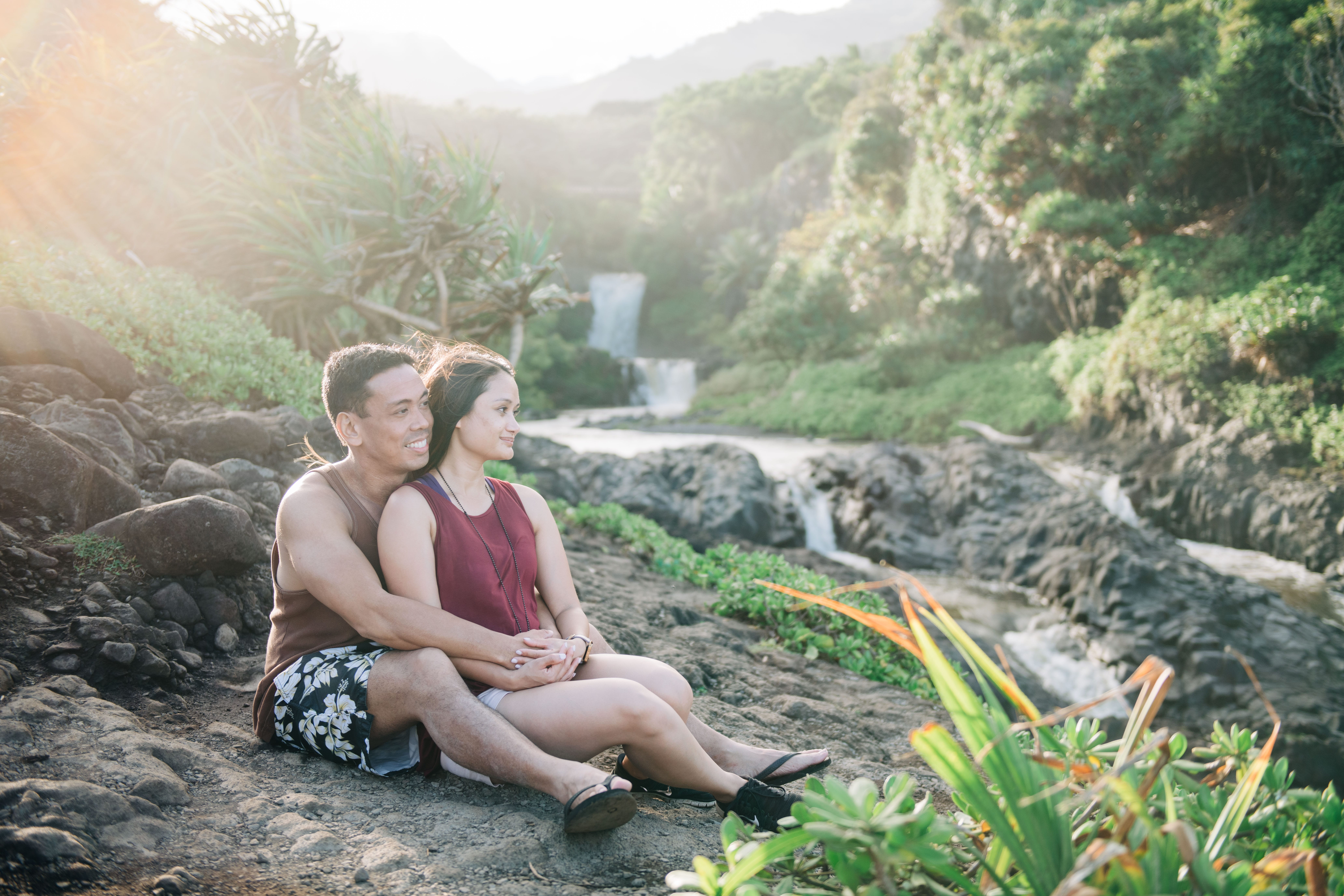 romantic couple appreciating the cliffside view during a Maui Engagement Session