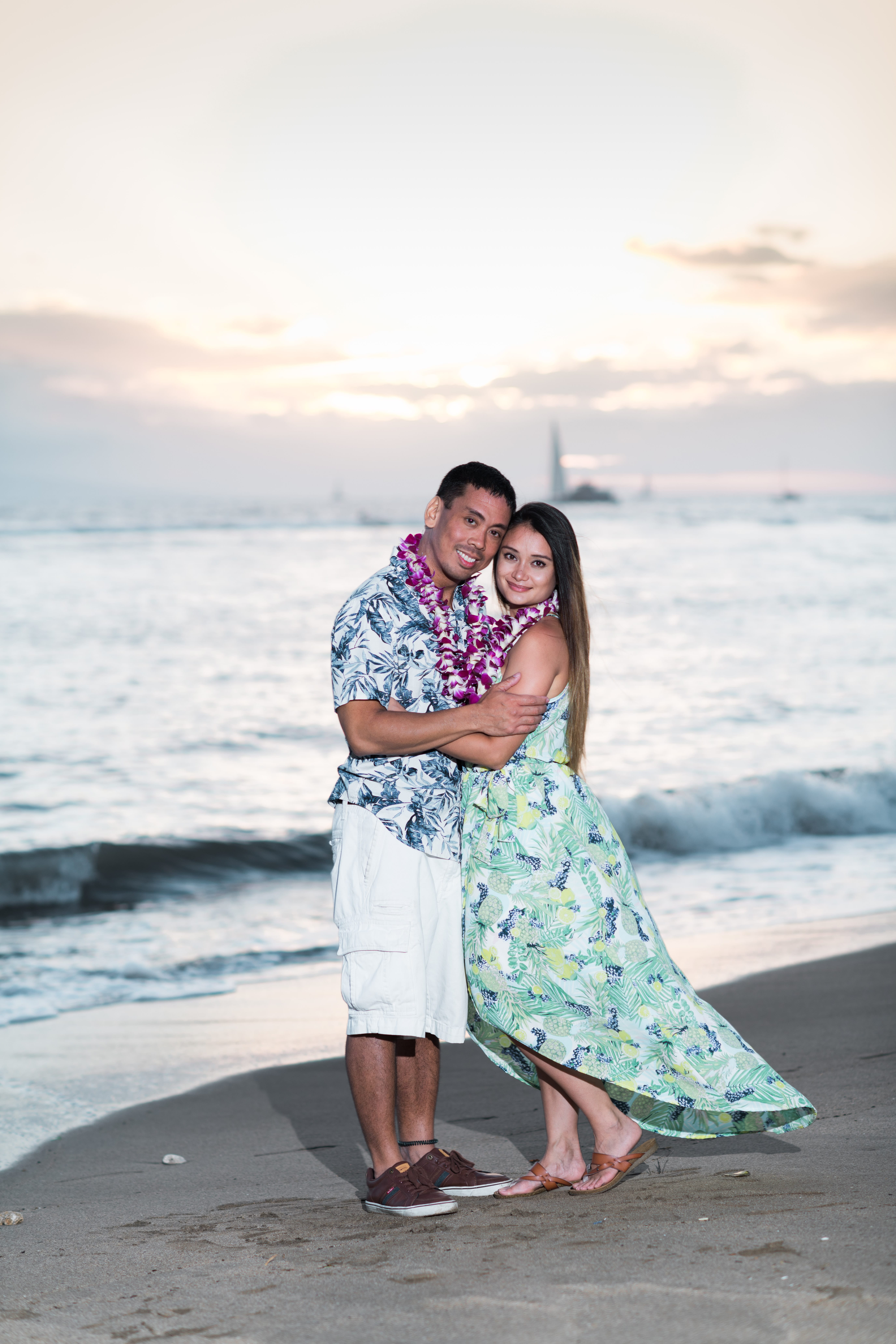 romantic couple posing at sunset in a Maui beach