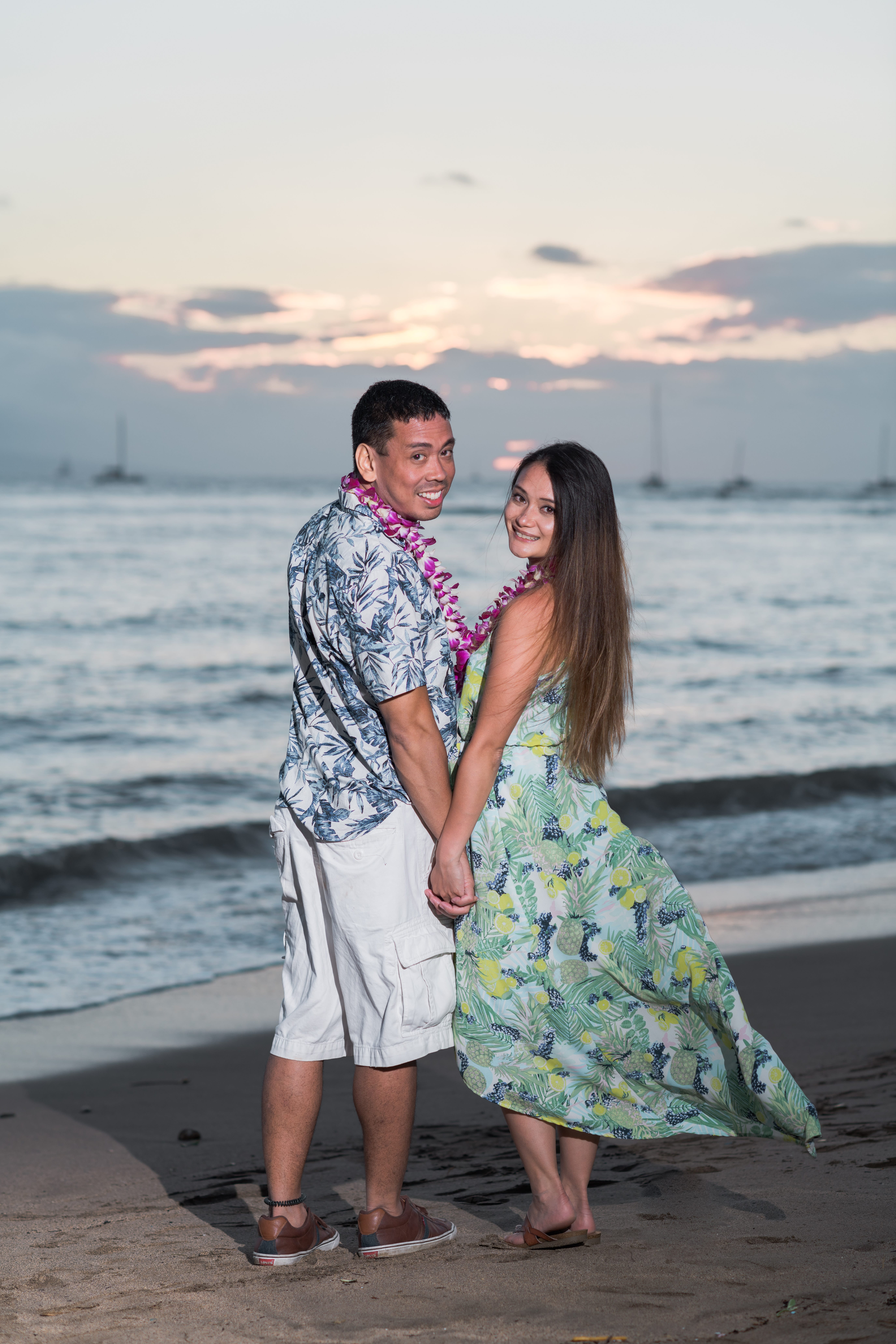 romantic couple posing at sunset in a Maui beach