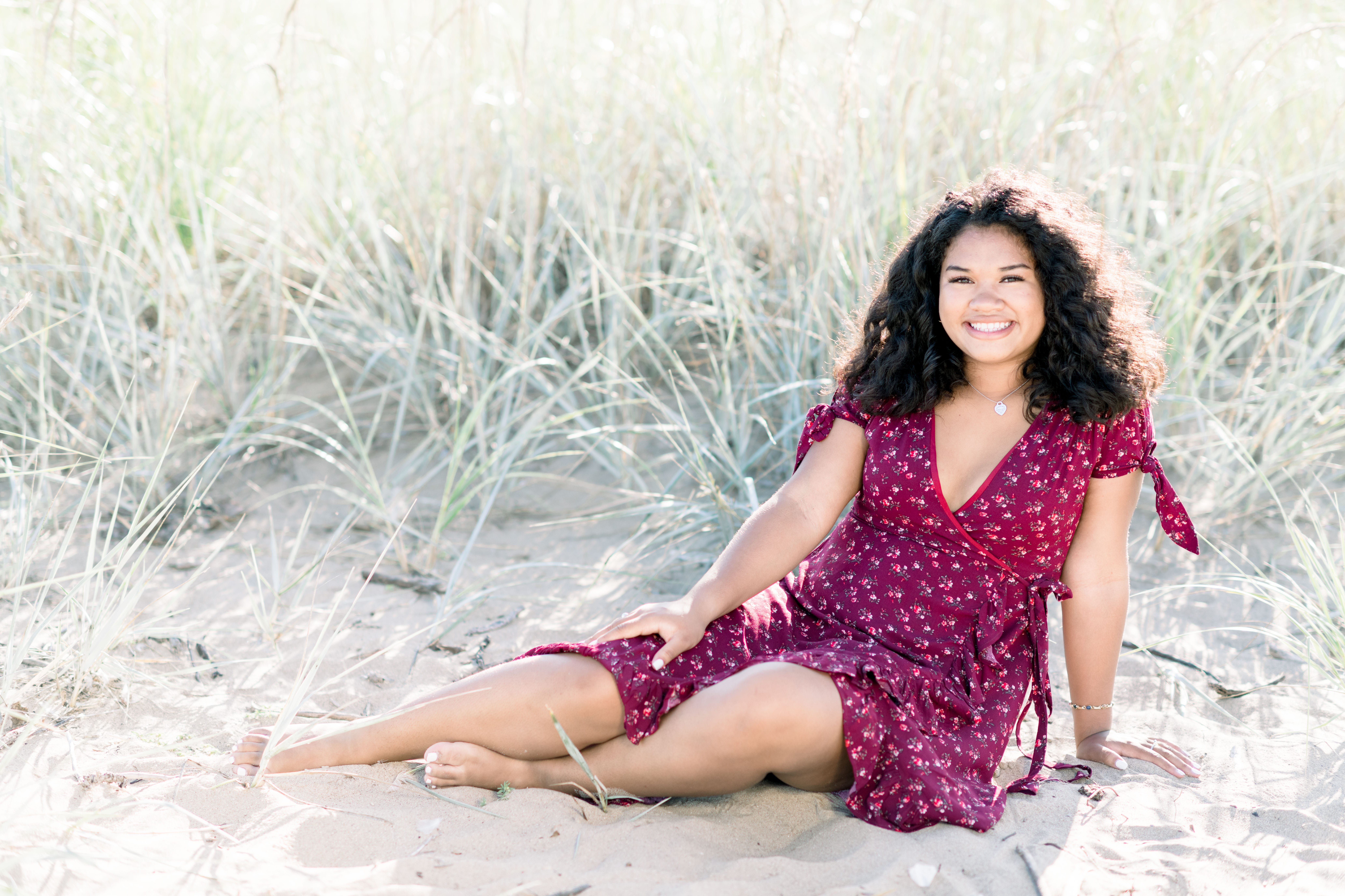 Posing on the sand during a senior portrait session