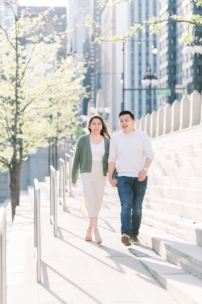 Couple walking hand in hand at the Chicgao Riverwalk