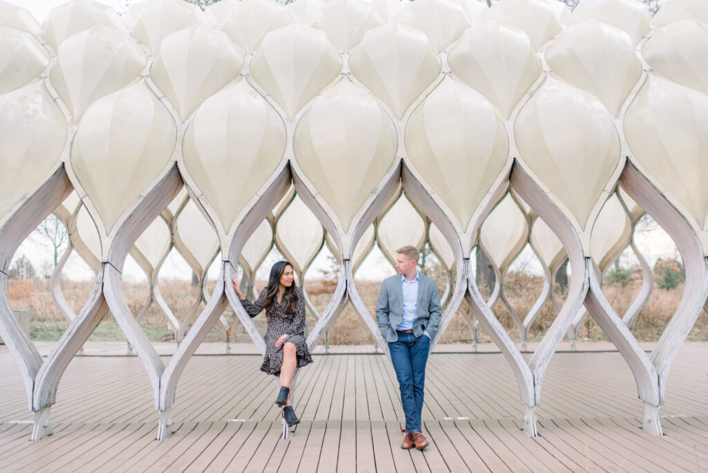 Couple sitting on the Honeycomb structure at Lincoln Park Chicago 