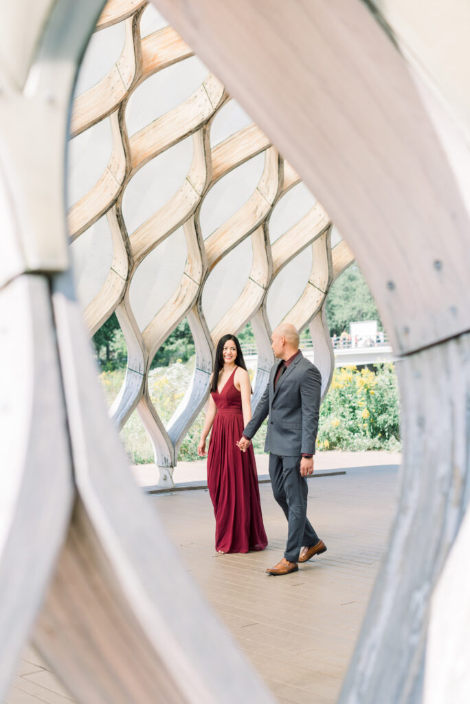 Couple walking under the Honeycomb structure at Lincoln Park Chicago 